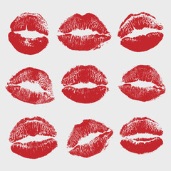 Print of red lips set. World kiss day, Valentine's day design elements. Vector illustration of womans girl red lipstick kiss mark isolated on white background.