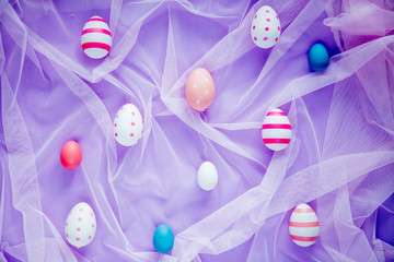 colored Easter eggs and pink tulle