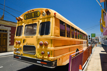 Naklejka na ściany i meble Yellow,American school bus in Arica,Chile.