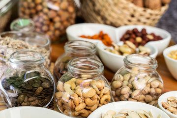 Various piles of mixed nuts and seeds
