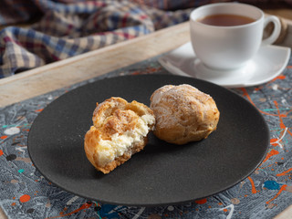 Delicate profiteroles with whipped cream