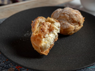 Delicate profiteroles with whipped cream