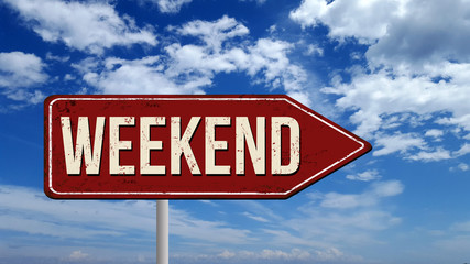 Weekend metallic vintage sign over blue sky