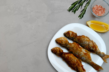 Crispy pan fried fish with lemon and rosemary