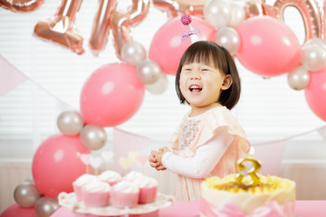 toddler girl celebrating her third birthday at home