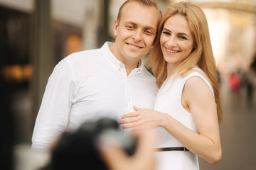 Happy couple walk in the centre of the city. Wiena, Austria