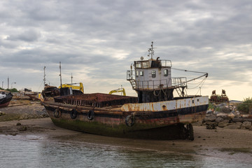 An old ship in the beach of Tavira (Portugal)