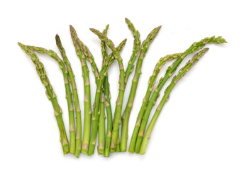 Fresh green asparagus on white
