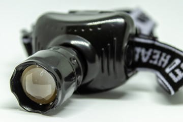 a closeup headtorch shoot with white background
