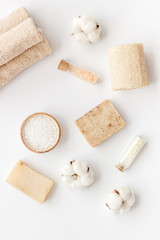 Zero waste set with cosmetics for spa and cotton materials on white background top view