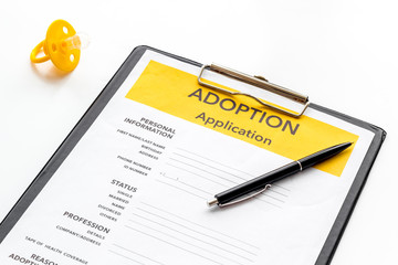 Application to adopt child with dummy on white background