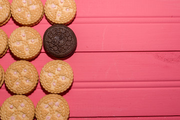 strawberry-flavored cream-filled cookies together with chocolate cookie