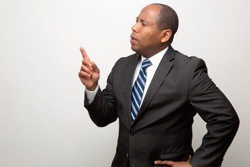 African American Business Man Looking Away and Pointing