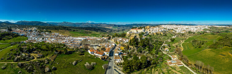 Fototapeta na wymiar Ronda Spain aerial view of medieval hilltop town surrounded by walls and towers with famous bridge over gorge