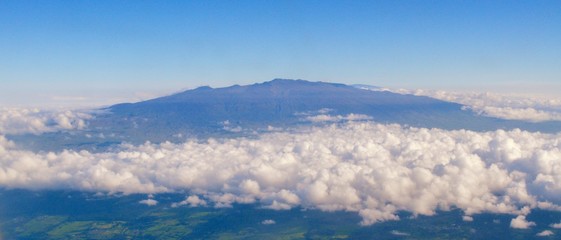 Fototapeta premium Scenic Landscape view from plane, clouds, sky, mountain, volcano, plaines