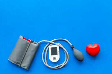 cardiologist work desk with pulsimeter on blue background top view mockup