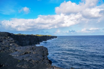waves crashing on jagged cliffs