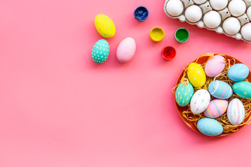 eggs with colorful paint for easter tradition on pink background top view mockup