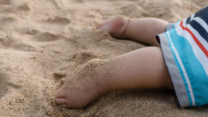 baby feet on the beach