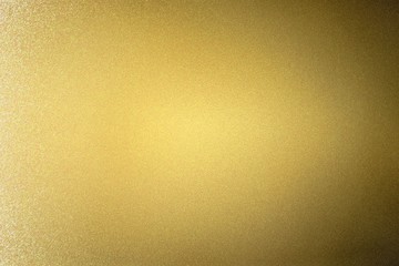 Naklejka premium Abstract texture background, reflection brushed gold metallic wall in dark room