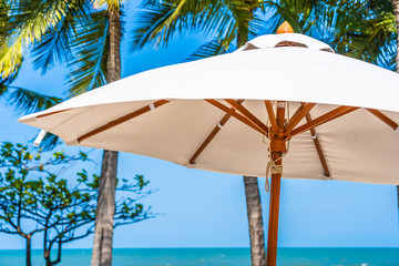Beautiful landscape of sea ocean on sky with umbrella and chair around luxury outdoor swimming pool