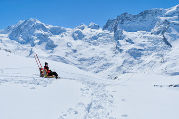Fototapeta na wymiar Young Woman Tourists see beautiful view of snow mountain Matterhorn peak, Zermatt, Switzerland.