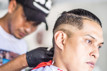 Fototapeta premium day in traditional barbershop, man cut hair