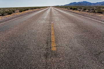 Naklejka premium A long, straight, narrow road in the Grand Canyon.
