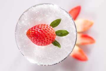 Ripe strawberry split on cup