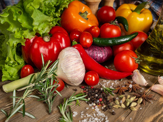Fresh vegetables bell pepper, hot pepper, tomatoes, spices, olive oil