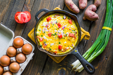 Cast Iron Skillet Frittata with tomatoes scallions and potatoes