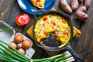 Cast Iron Skillet Frittata with tomatoes scallions and potatoes
