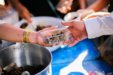 Food support: People are handing over food from volunteers with philanthropists to support cooking.