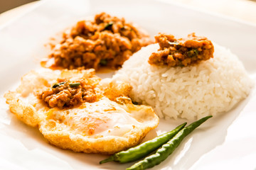 Panaeng  curry  with egg and rice in plate, Thai famous food