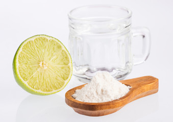 Glass of water, lemon, soda bicarbonate - Citrus × latifolia