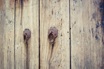 Detail of an old door and knocker. Selective focus.