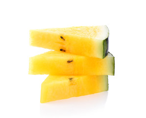 Yellow watermelon sliced on white background.