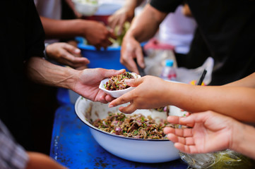 Charity concept : Feeding the poor to help each other in society.