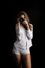 Fashion Portrait of young Woman photographer with camera