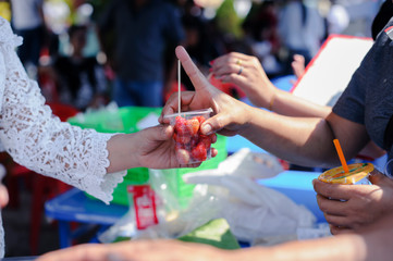 Starvation concept : Rich people give food to the poor.