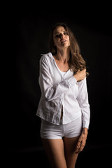 Beautiful woman with healthy body on black background