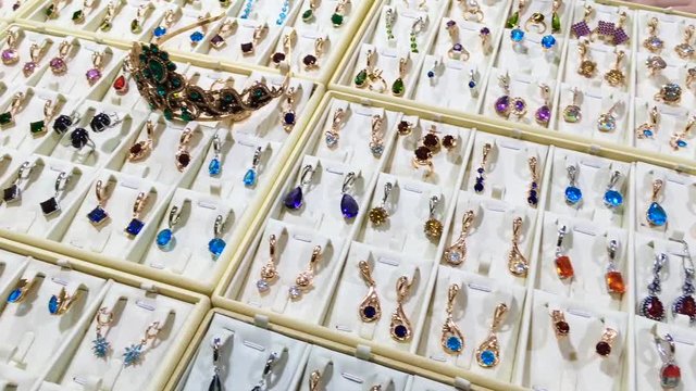 Jewelry for sale. Golden and dilver rings with gemstones jewelry for women in the market