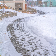 Obraz premium Curving pathway along snowy ground in Daybreak