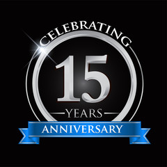 Celebrating 15 years anniversary logo. with silver ring and blue ribbon.