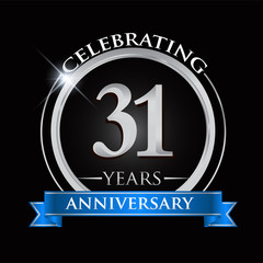 Celebrating 31 years anniversary logo. with silver ring and blue ribbon.