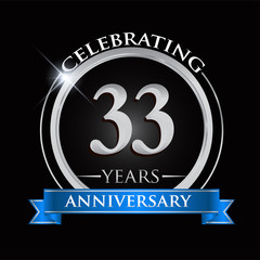 Celebrating 33 years anniversary logo. with silver ring and blue ribbon.