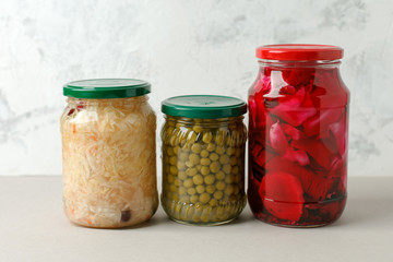 Marinated pickles variety preserving jars. Homemade green beans, sauerkraut with cranberries, pickled cabbage with beetroot. Fermented food, copy space