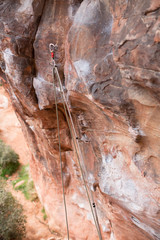 Rock climbing safety stick clip sport climbing in canyon