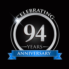 Celebrating 94 years anniversary logo. with silver ring and blue ribbon.