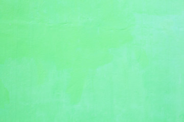 freshly painted light green colored plain seamless grunge textured plastered rough wall background in rustic Asian house. Home Interior Architectural Design, Wallpaper, Flooring and Backdrop concept